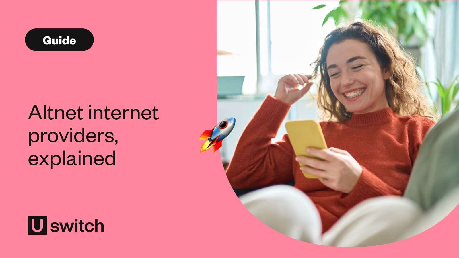 woman smiling at her phone while sat on her sofa