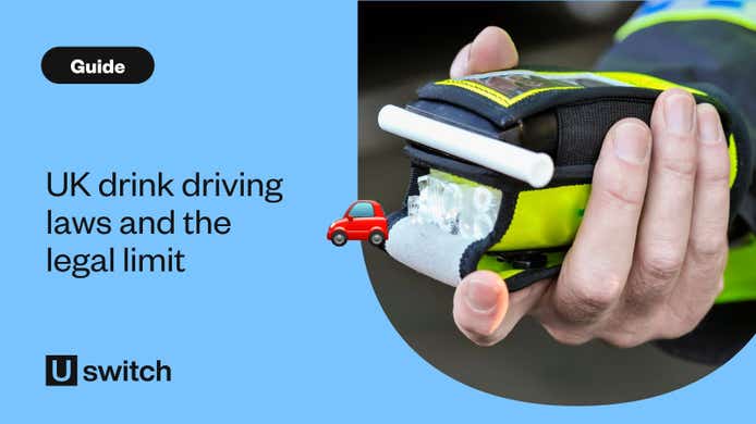 police officer holding a breathalyser