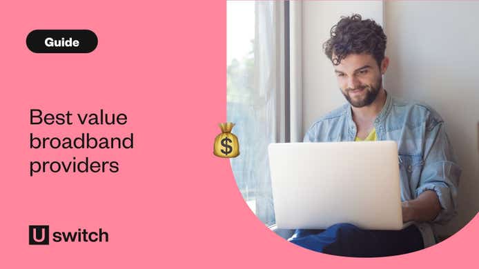 man sat at home smiling using his laptop