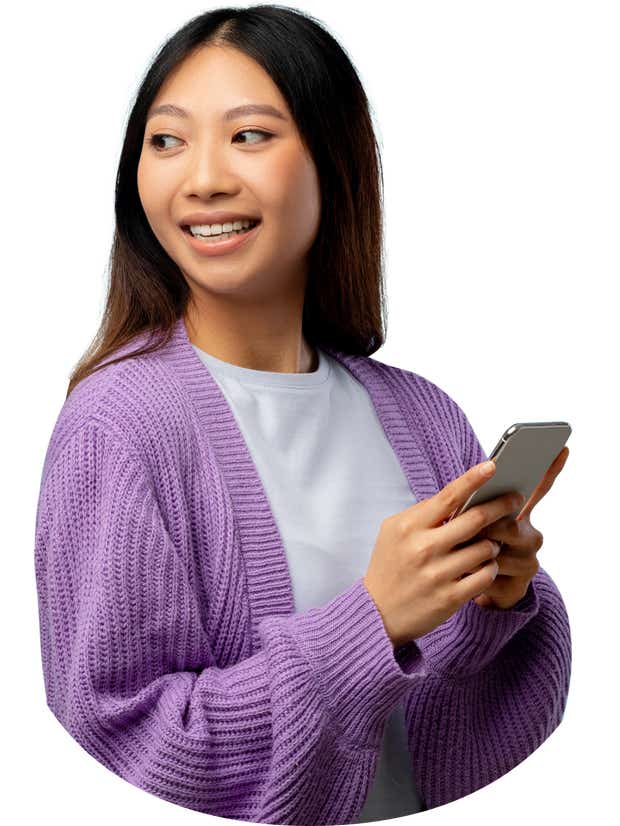 Happy woman in purple cardigan holding phone